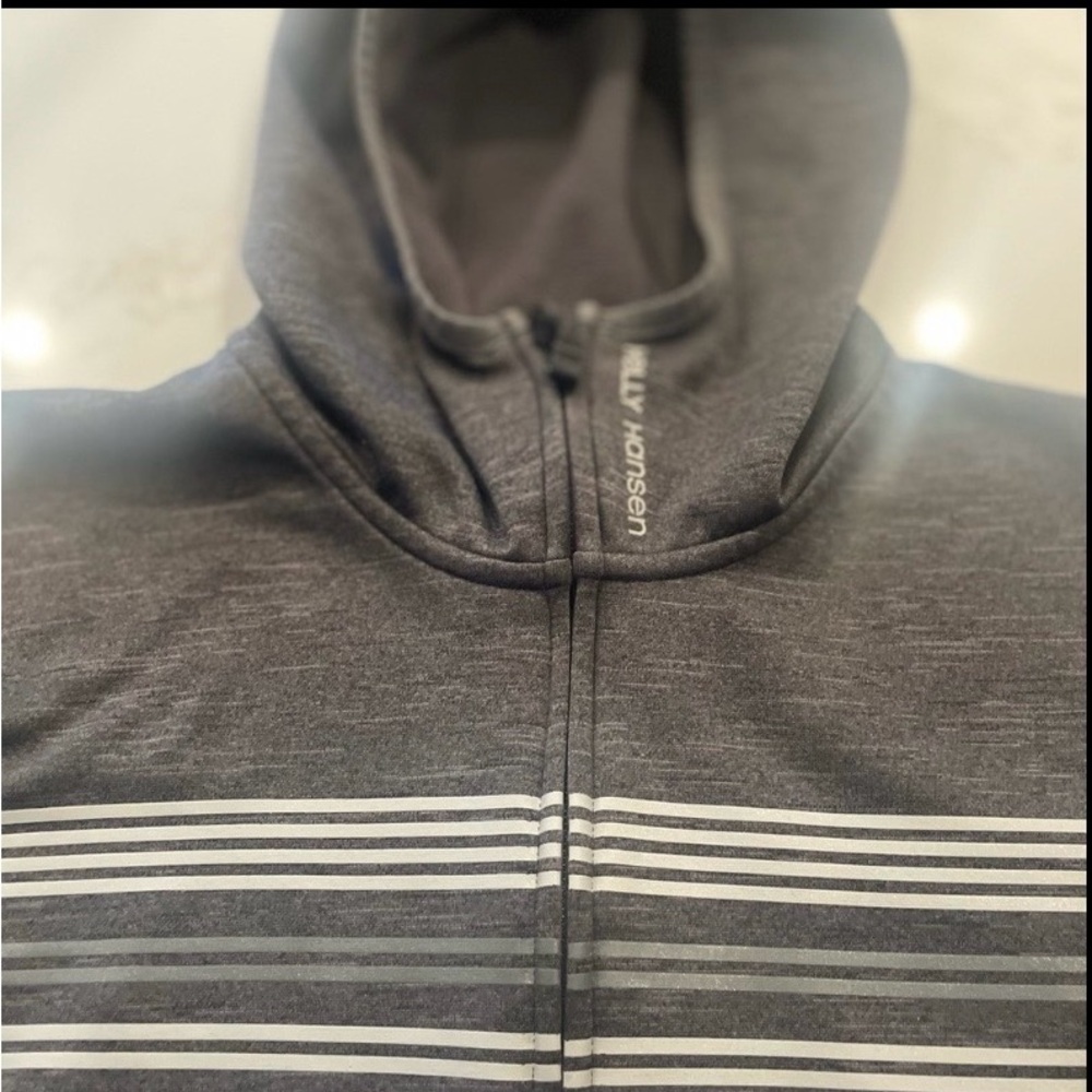 Dark Gray Helly Hansen Zip-Up Hoodie With Striped Front.